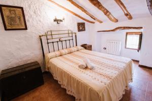 Postel nebo postele na pokoji v ubytování Cortijo Rural Majolero