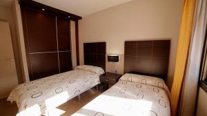 Säng eller sängar i ett rum på Albir Palace