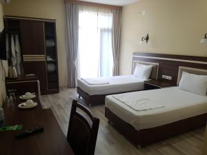 Postel nebo postele na pokoji v ubytování Hotel 725 B