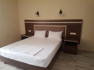 Postel nebo postele na pokoji v ubytování Hotel 725 B