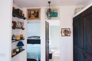 a bedroom with a bed and a door leading into a room at La Torretta in Lerici +37 photos