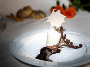 a piece of chocolate cake on a plate at Hotel Andreaneri in Marina di Pietrasanta