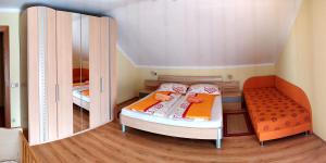 a small childs bedroom with a bed and a closet at Ferienwohnungen Schneider in Sankt Kanzian +13 photos