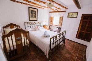 Postel nebo postele na pokoji v ubytování Cortijo Rural Majolero