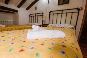 Postel nebo postele na pokoji v ubytování Cortijo Rural Majolero