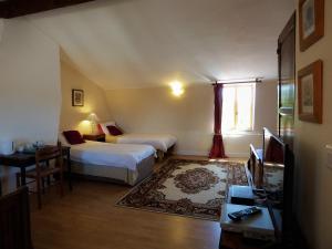 Postel nebo postele na pokoji v ubytování L'Ancien Presbytère Chambres D'hote ou Gite