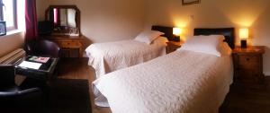 Un pat sau paturi într-o cameră la Miltons Country Lodge