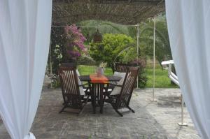 a table and chairs sitting under a tent at Villa Albachiara in Camogli