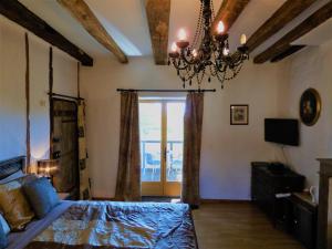 Postel nebo postele na pokoji v ubytování L'Ancien Presbytère Chambres D'hote ou Gite