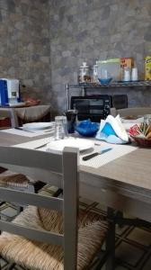 a table in a kitchen with a counter top at A casa di Gio’ in Marsala