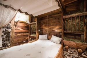 Postel nebo postele na pokoji v ubytování Hotel Ciamp