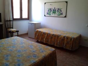A bed or beds in a room at Canne Al Vento