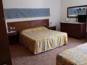 A bed or beds in a room at Canne Al Vento