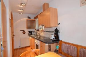a kitchen with a sink and a counter top at Haus Marent in Bartholomäberg +25 photos