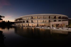 a large body of water with a large building at Pestana Vila Sol Golf & Resort Hotel in Vilamoura