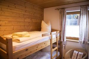 מיטה או מיטות בחדר ב-Haus Ritzenspitze
