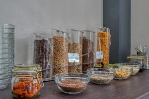 a counter filled with lots of different types of food at Centro Hotel Böblingen in Böblingen