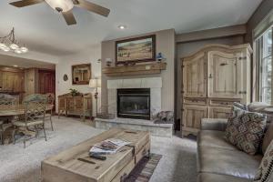 a living room with a couch and a fireplace at 2Br- Arrowhead Village- Great Location And Gorgeous Condo Condo in Beaver Creek
