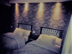 Ένα ή περισσότερα κρεβάτια σε δωμάτιο στο Castle Hostel