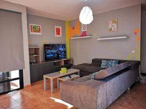TV a/nebo společenská místnost v ubytování Lau Haizeta Beach