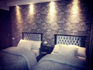 Ένα ή περισσότερα κρεβάτια σε δωμάτιο στο Castle Hostel