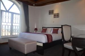 Ein Bett oder Betten in einem Zimmer der Unterkunft Villa Asimba