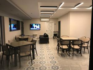 TV a/nebo společenská místnost v ubytování Oyster Boutique Hotel