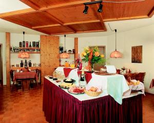 a table with food on it in a room at Aparthotel Kupferkanne in Todtmoos