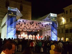 a group of people on a stage at night at Maison Mavù Perugia in Perugia