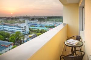 a balcony with a view of a city at Sun and holidays apartament Władysława IV in Gdynia