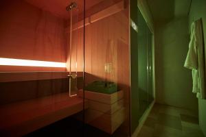 a bathroom with a glass shower with a sink at Musae Relais & SPA in Polignano a Mare