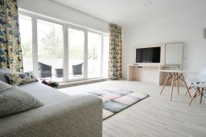 A television and/or entertainment centre at Moment Apartments