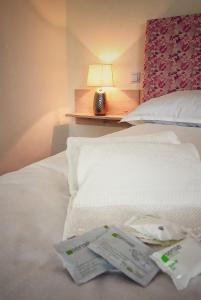 A bed or beds in a room at Moment Apartments