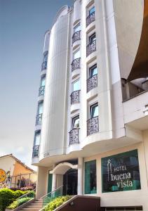 a large white building with a sign on it at Hotel Buena Vista in Bucaramanga