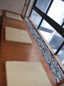 a set of stairs with rocks and a window at Pavilion Fahrenheit 88 Bukit Bintang 3 bedrooms in Kuala Lumpur