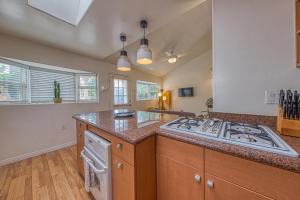 a kitchen with a stove and a counter top at Cottage By Mission Bay in San Diego