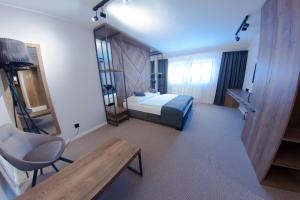 Postel nebo postele na pokoji v ubytování Hotel Praha