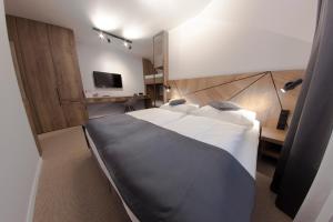 Postel nebo postele na pokoji v ubytování Hotel Praha