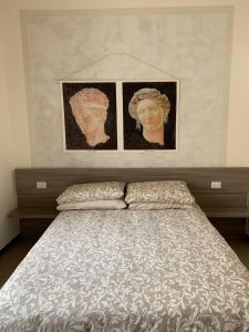 Uma cama ou camas num quarto em Scala Family Home