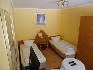 Postel nebo postele na pokoji v ubytování Hotel Ottersleben