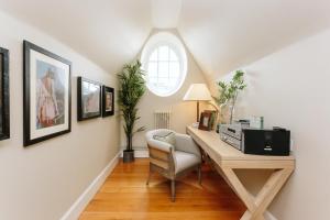 a home office with a desk and a window at The Scotsman Hotel in Edinburgh