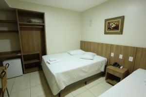 Montblanc Hotel tesisinde bir odada yatak veya yataklar