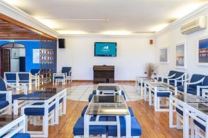 Una televisión o centro de entretenimiento en Mirachoro Portimao