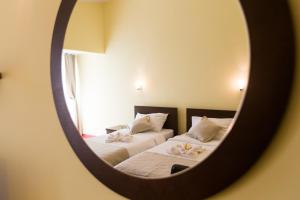 Кровать или кровати в номере Hotel Odissey