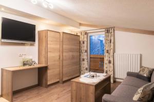 Televízia a/alebo spoločenská miestnosť v ubytovaní Bergspitz Luxury Appartement