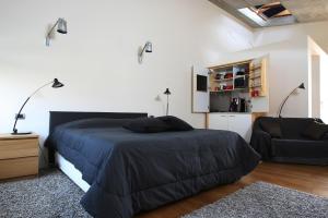 מיטה או מיטות בחדר ב-Studio OM by Valsabbion