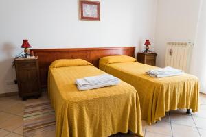 Llit o llits en una habitació de Torre Ancinale