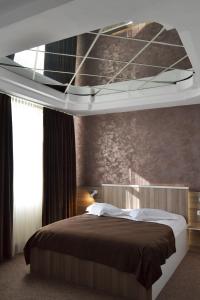 Uma cama ou camas num quarto em Hotel Rehoma