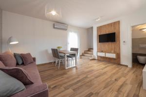 a living room with a couch and a table at LUXURY APARTMENTS - LA VIR 1 & 2 in Vir