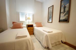 Cama o camas de una habitación en Livingtarifa Apartamento El Puerto
